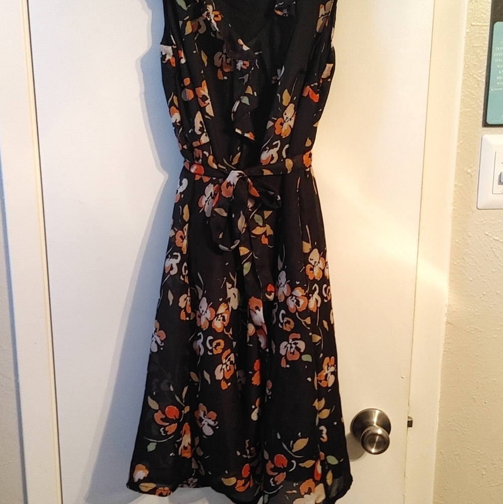 Black Flower dress with pockets, knee length.